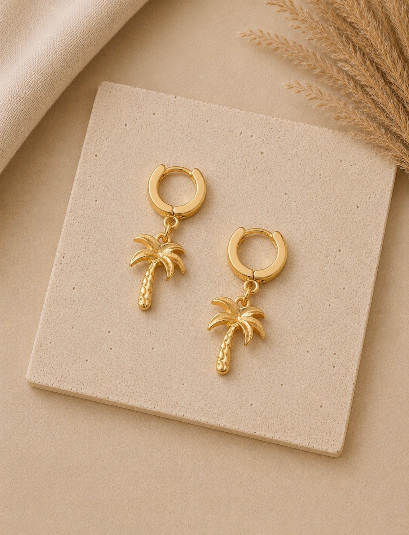golden palm huggie earrings