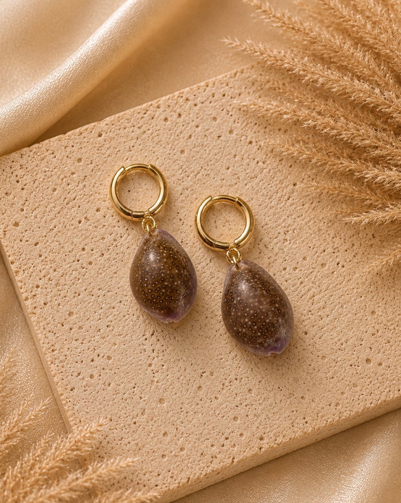 purple cowrie huggies