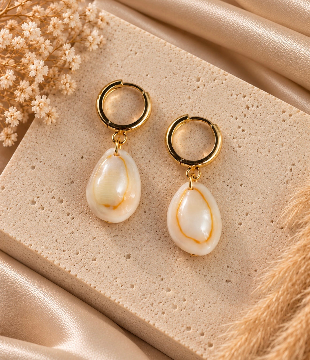 gold ring cowrie huggies